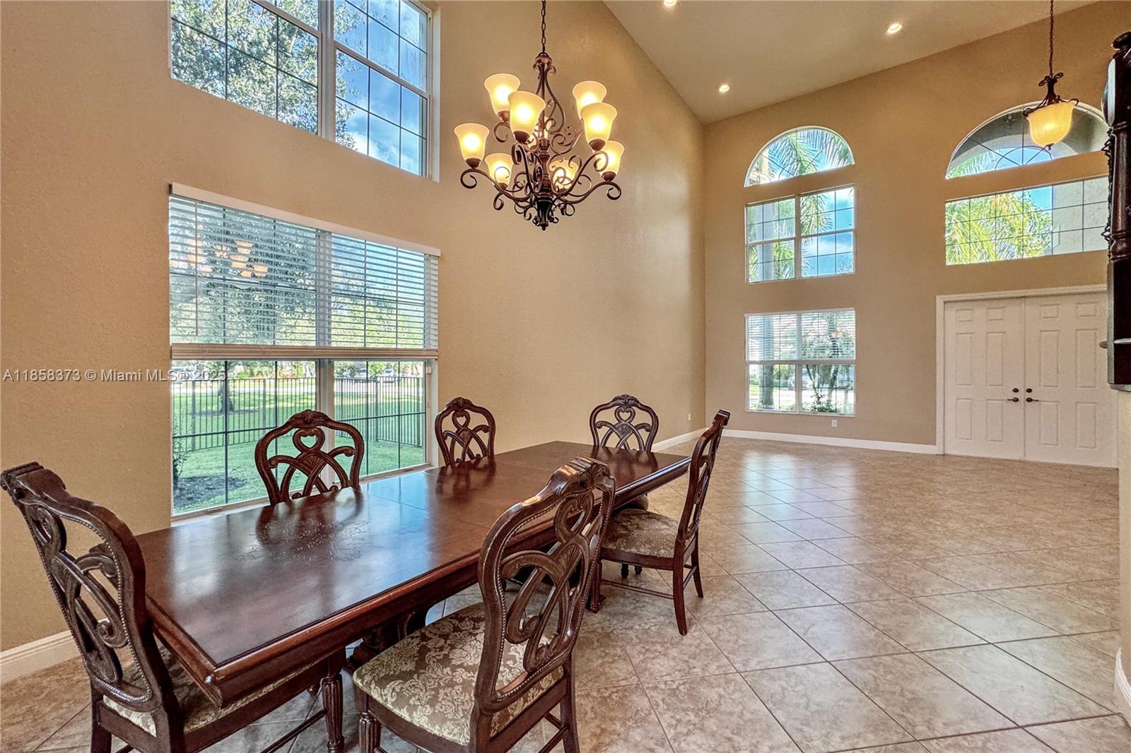 11894 Fox Hill Circle Boynton Beach, FL 33473 - Photo 6 of 35 a view of a dining room with furniture and window
