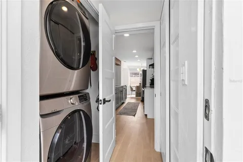 a view of a hallway with washer and dryer