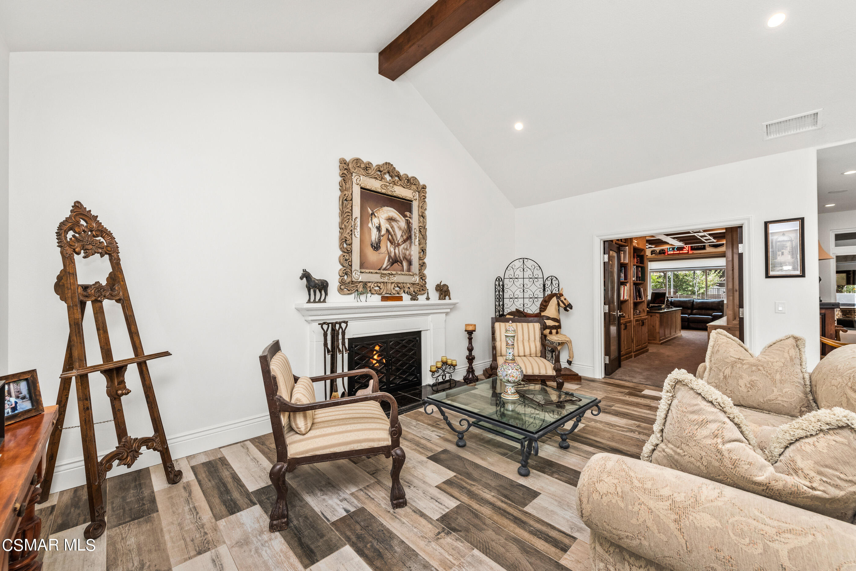 525 Aqueduct Court Simi Valley, CA 93065 - Photo 17 of 98 a living room with furniture a fireplace and wooden floor