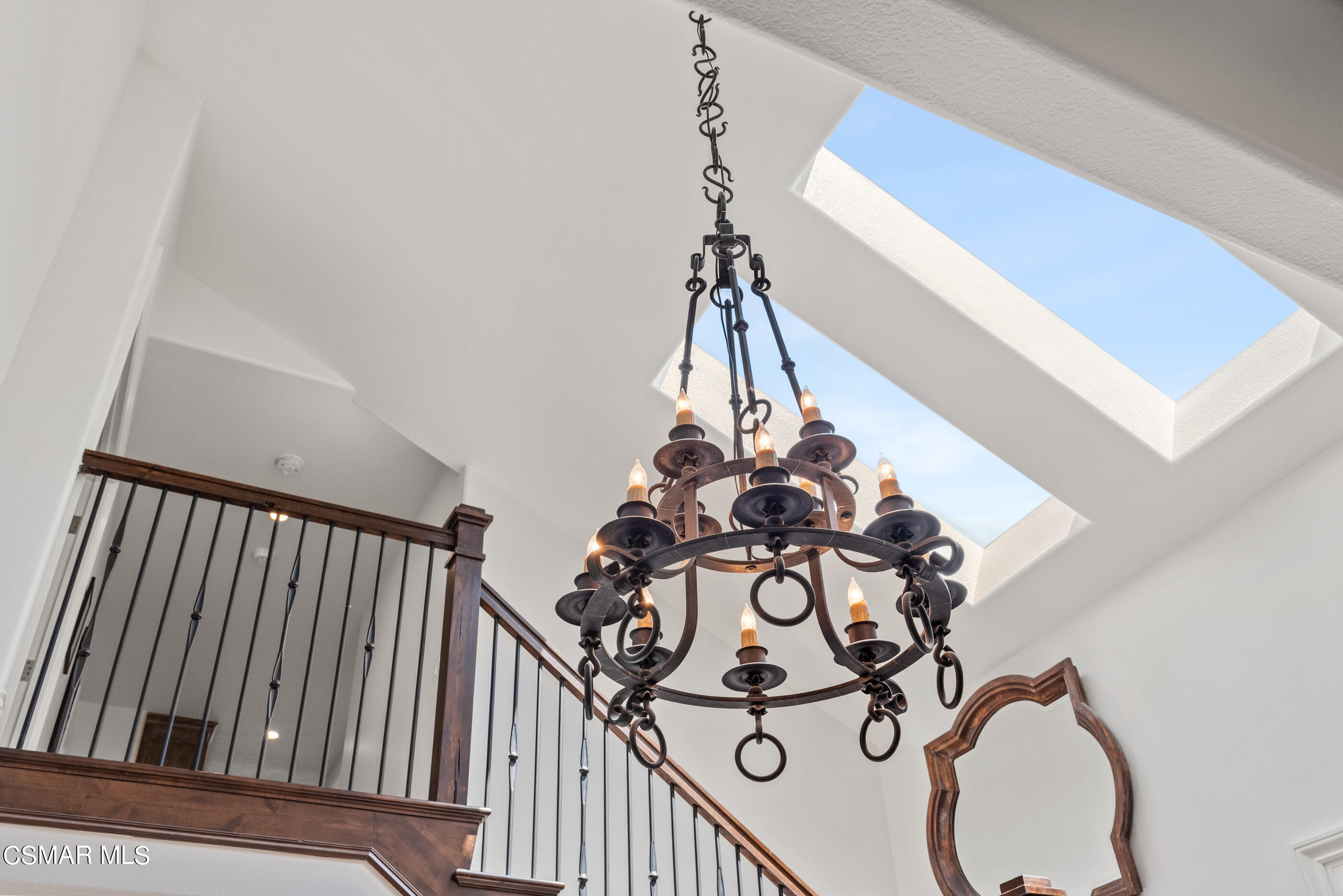 525 Aqueduct Court Simi Valley, CA 93065 - Photo 20 of 98 a view of a staircase with a white wall and a chandelier