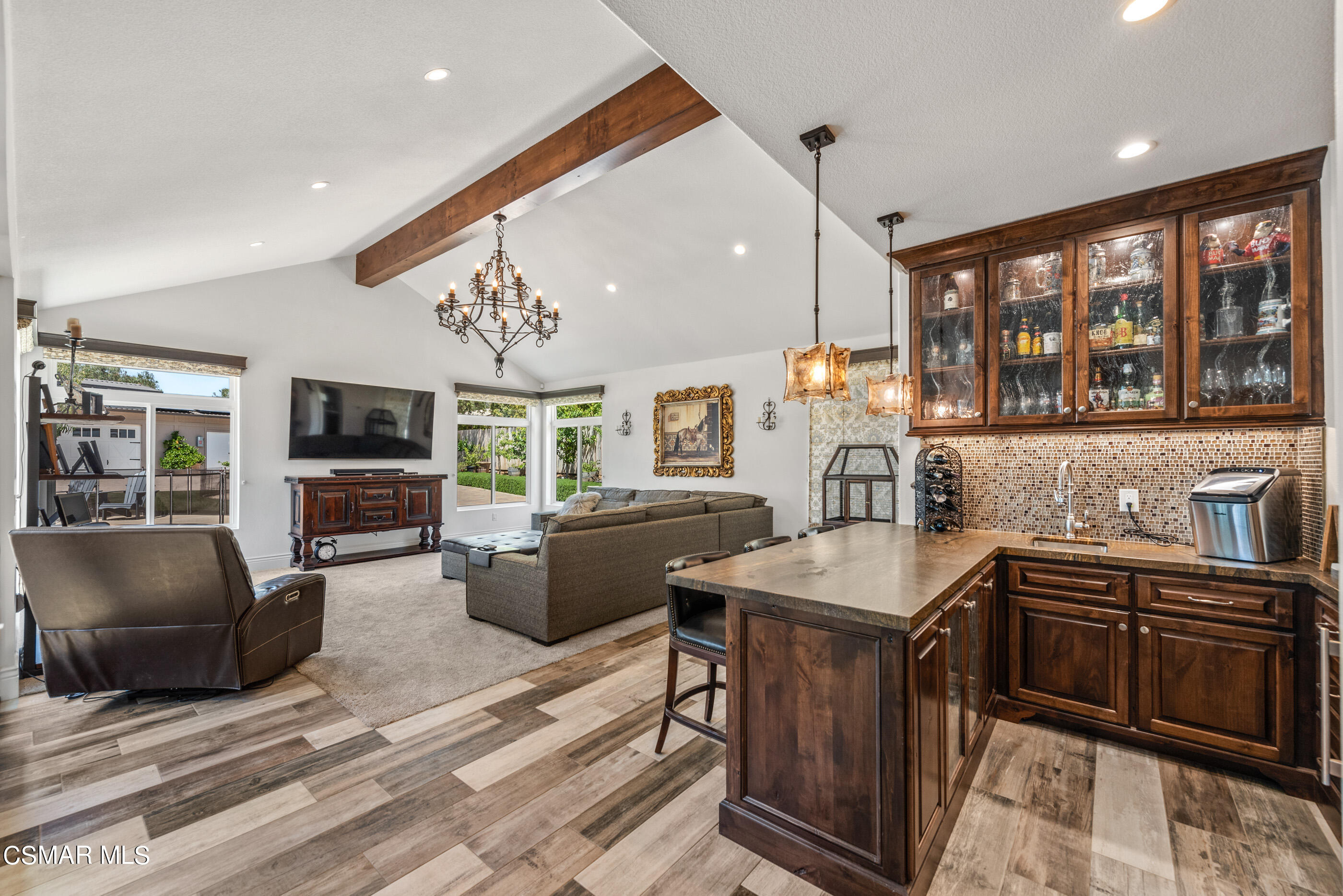 525 Aqueduct Court Simi Valley, CA 93065 - Photo 36 of 98 a kitchen with stainless steel appliances granite countertop a stove top oven a sink dishwasher a dining table and chairs with wooden floor
