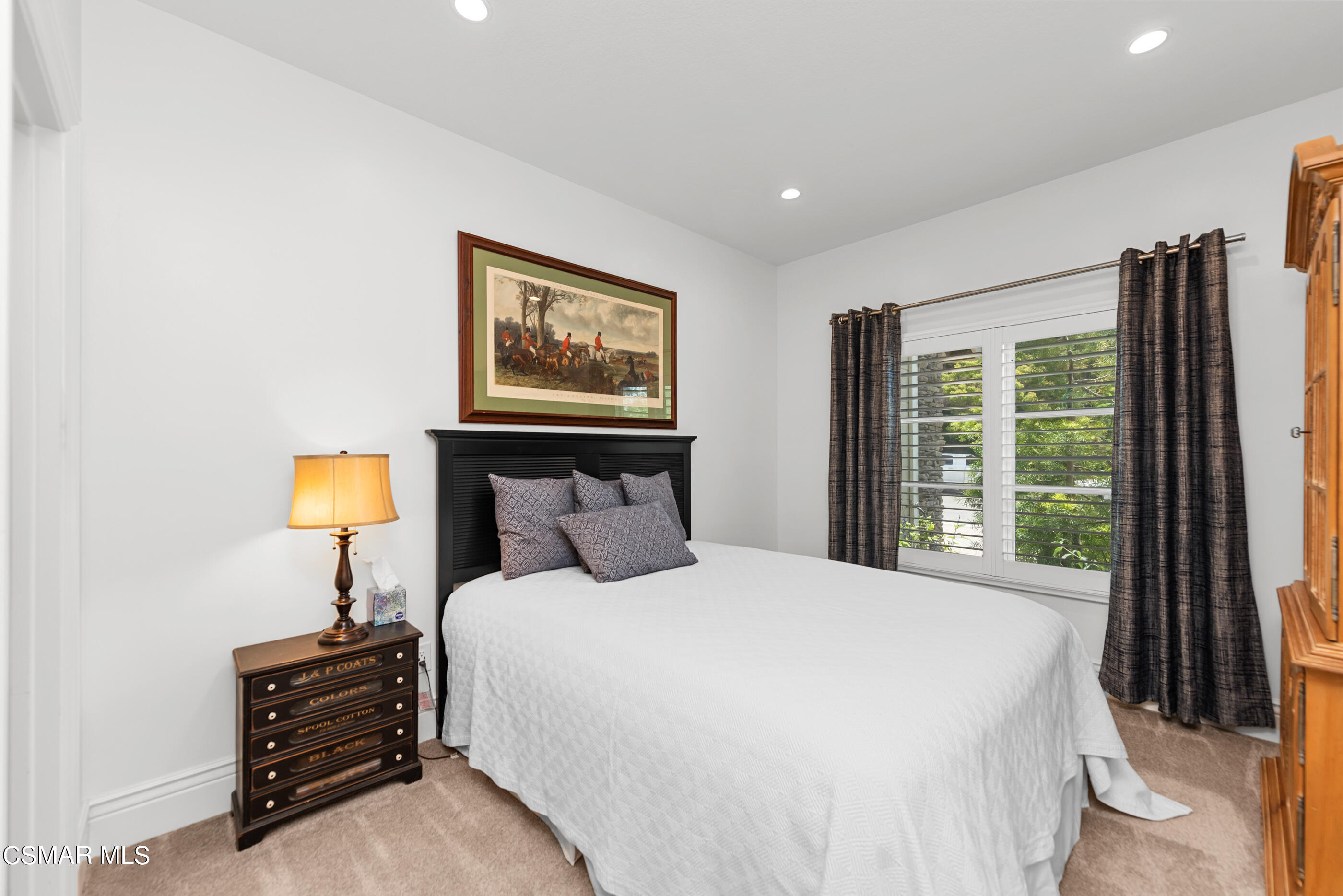 525 Aqueduct Court Simi Valley, CA 93065 - Photo 45 of 98 a bedroom with a bed and a chandelier
