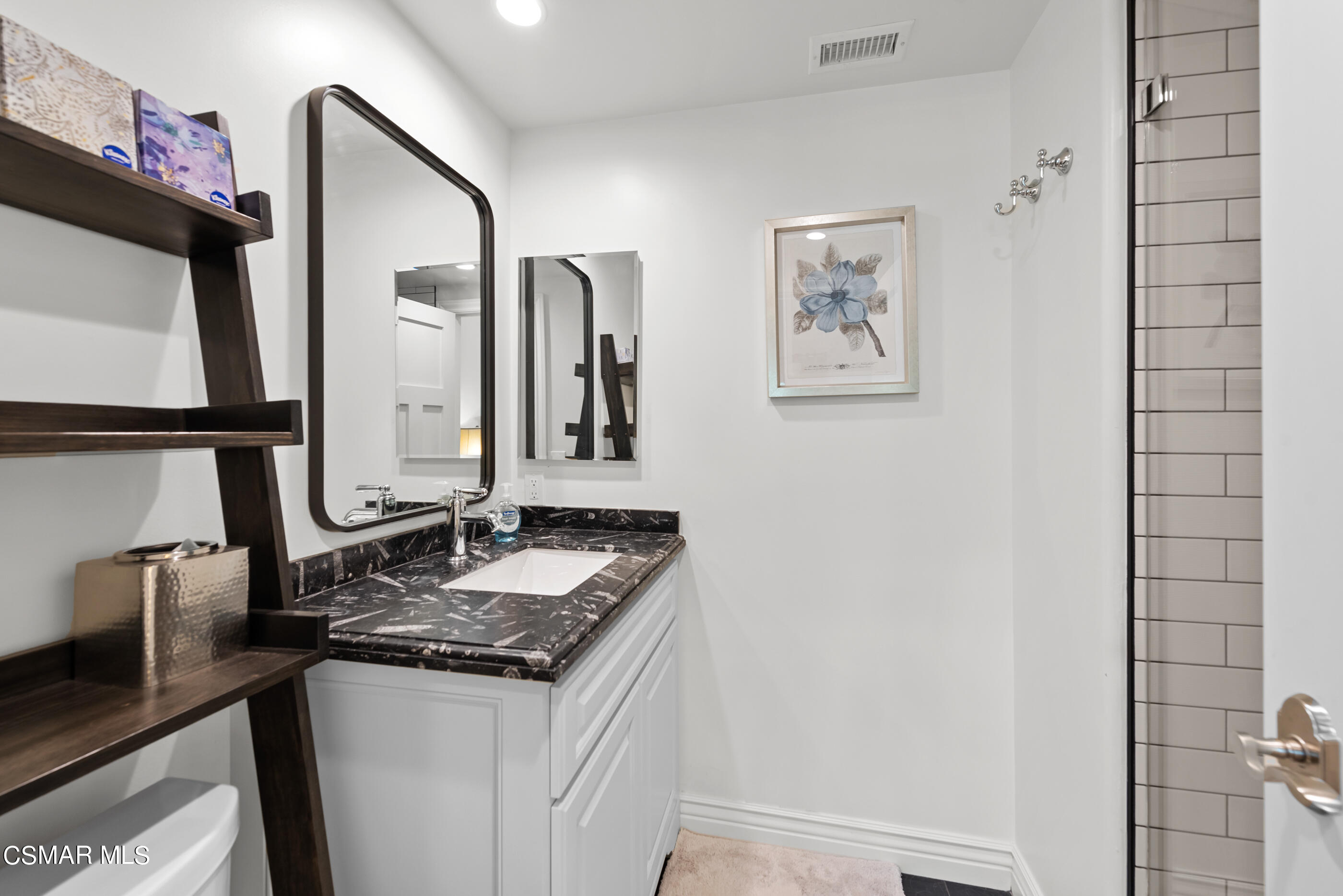 525 Aqueduct Court Simi Valley, CA 93065 - Photo 47 of 98 a bathroom with a granite countertop sink and a mirror