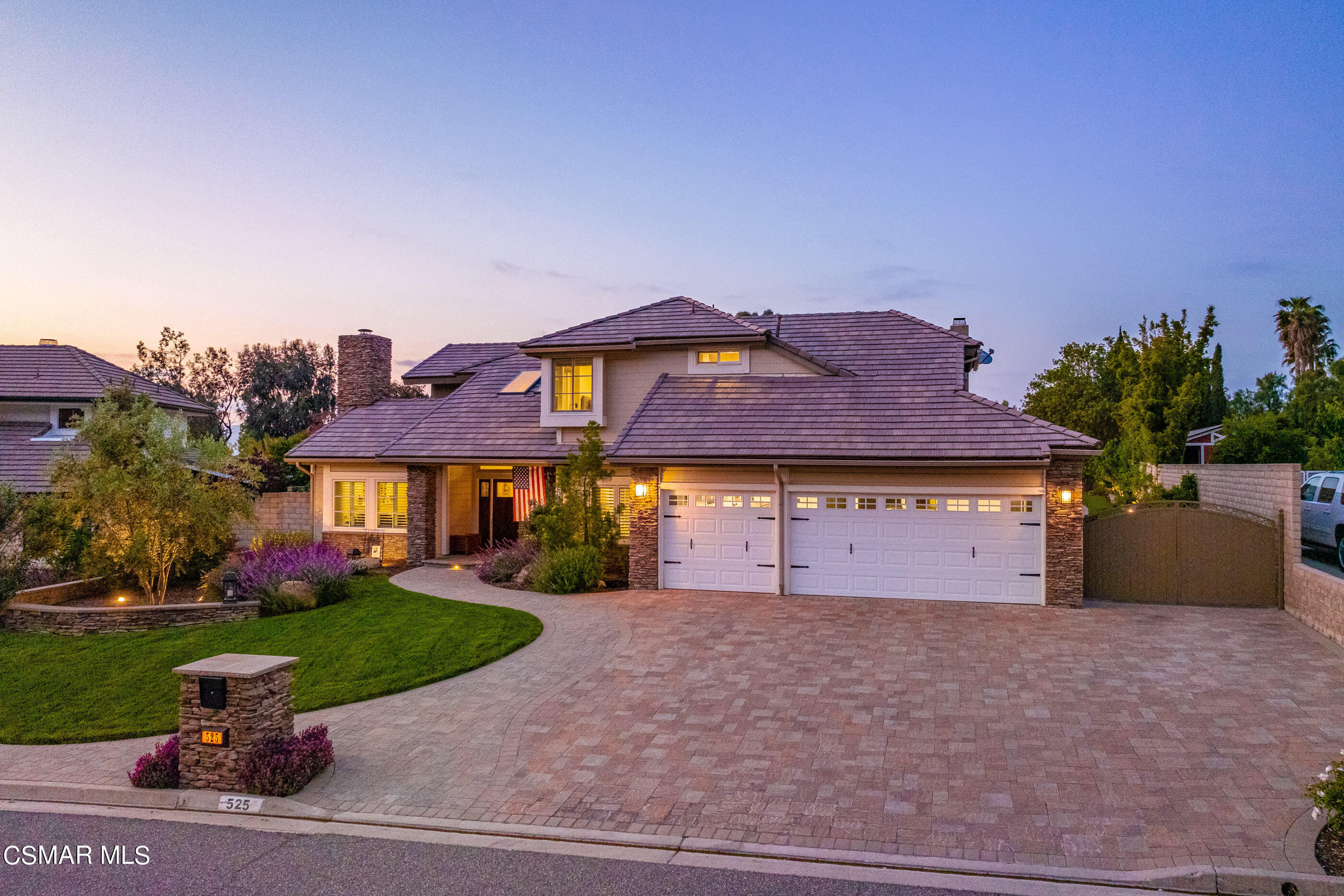 525 Aqueduct Court Simi Valley, CA 93065 - Photo 86 of 98 a front view of a house with a yard and a garage