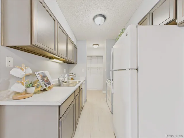 a utility room with cabinets washer and dryer