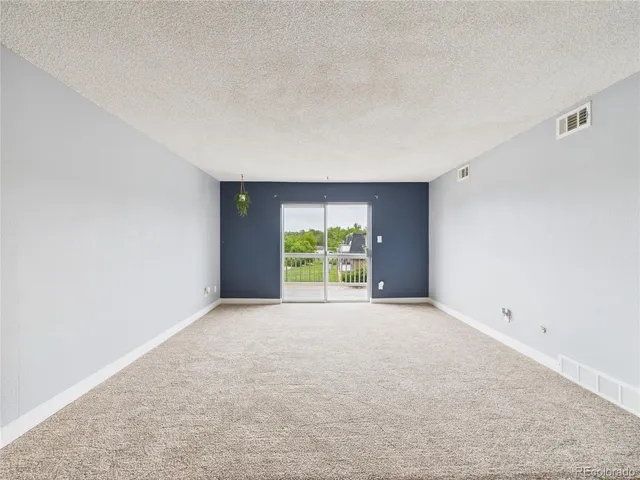 a view of an empty room with window