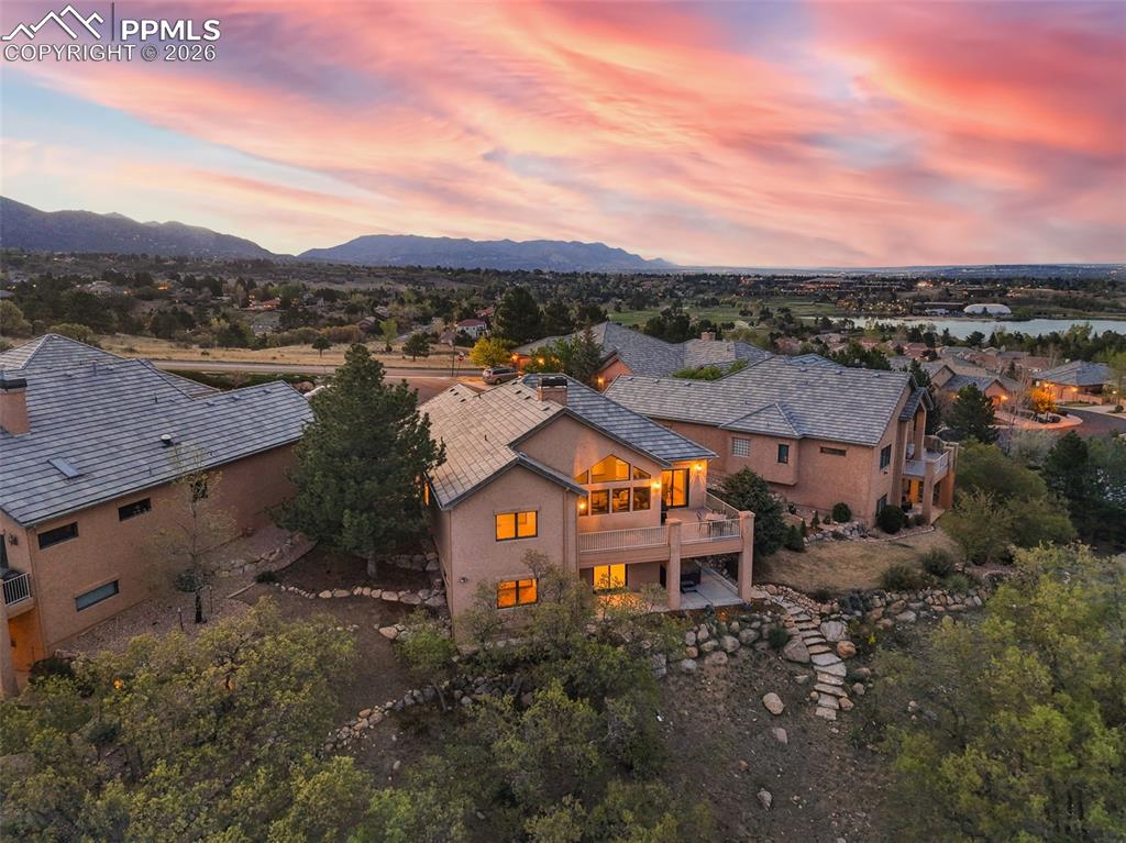 4215 Star Ranch Road Colorado Springs, CO 80906 - Photo 31 of 44 an aerial view of residential houses with outdoor space and ocean view