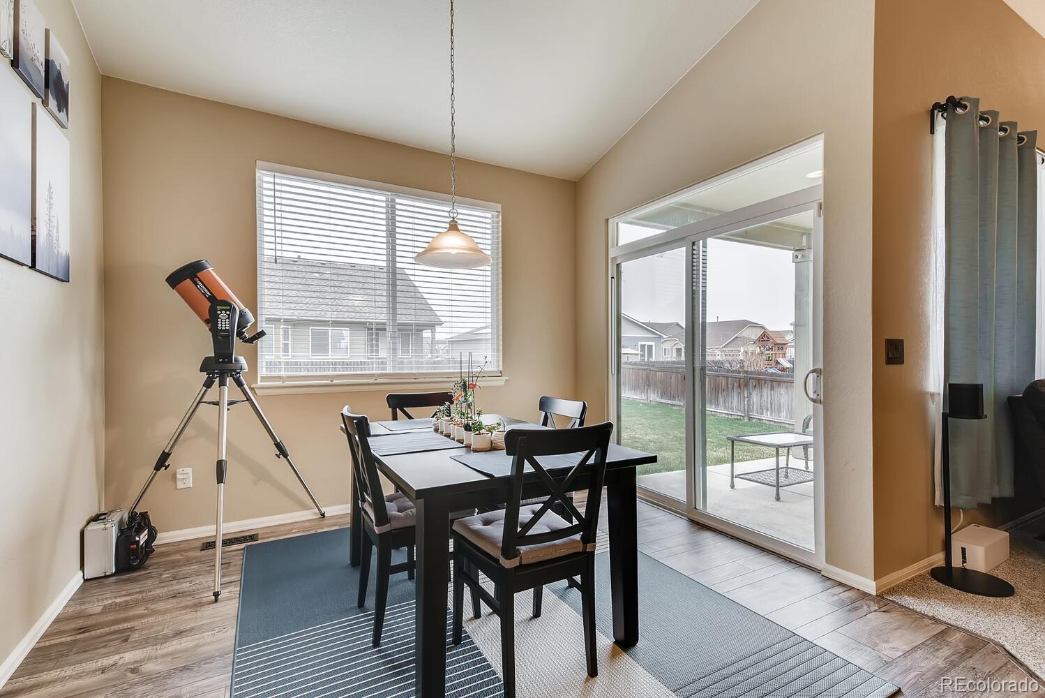 8413 Raspberry Drive Frederick, CO 80504 - Photo 11 of 27 a view of a dining room with furniture window and outside view