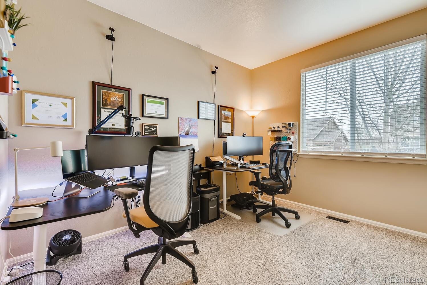8413 Raspberry Drive Frederick, CO 80504 - Photo 16 of 27 a view of a workspace with furniture and a window