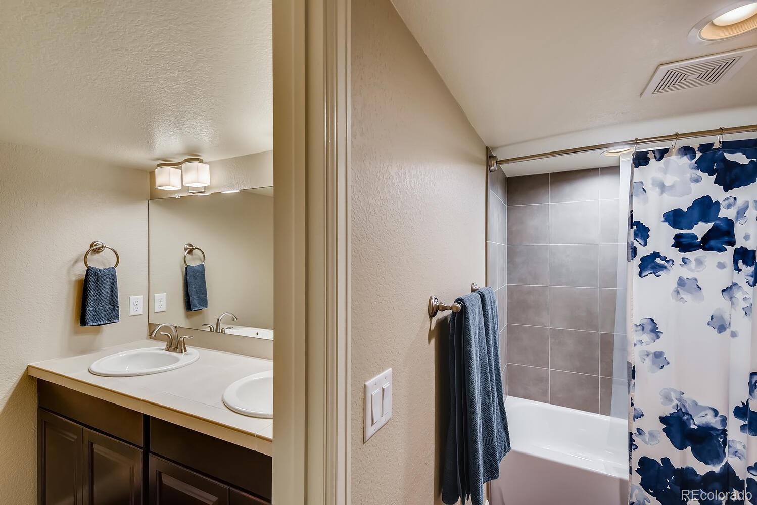 8413 Raspberry Drive Frederick, CO 80504 - Photo 21 of 27 a bathroom with a sink and a mirror