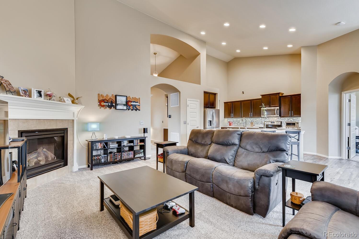8413 Raspberry Drive Frederick, CO 80504 - Photo 5 of 27 a living room with furniture and a fireplace