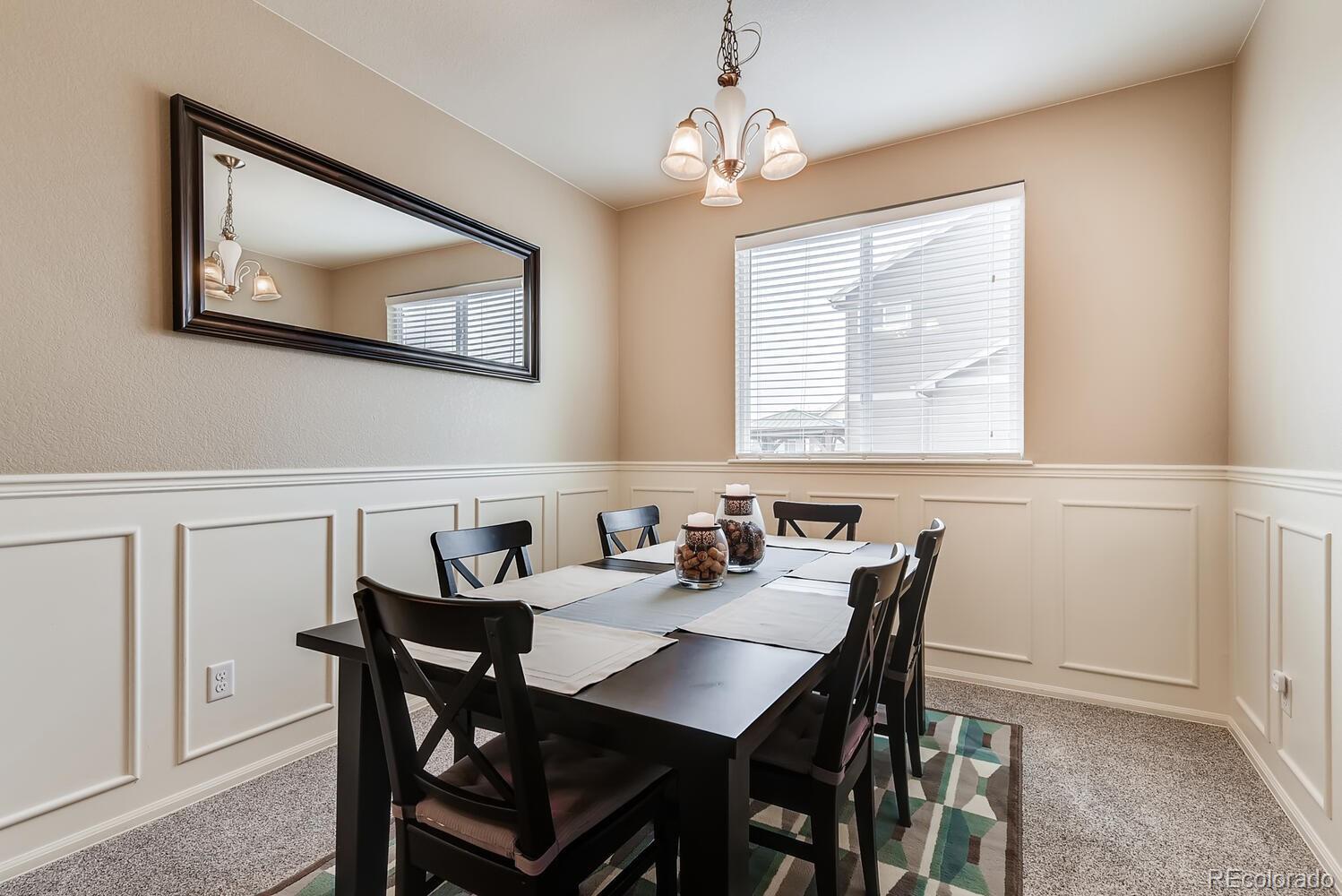 8413 Raspberry Drive Frederick, CO 80504 - Photo 6 of 27 a view of a dining room with furniture and window