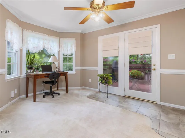 a view of a patio with table and chairs and potted plants