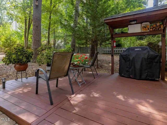 a living room with furniture and a lamp