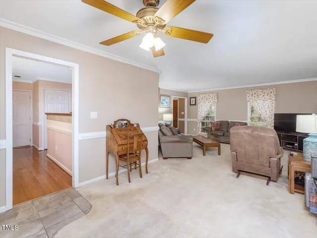 a view of a dining room with furniture wooden floor and chandelier