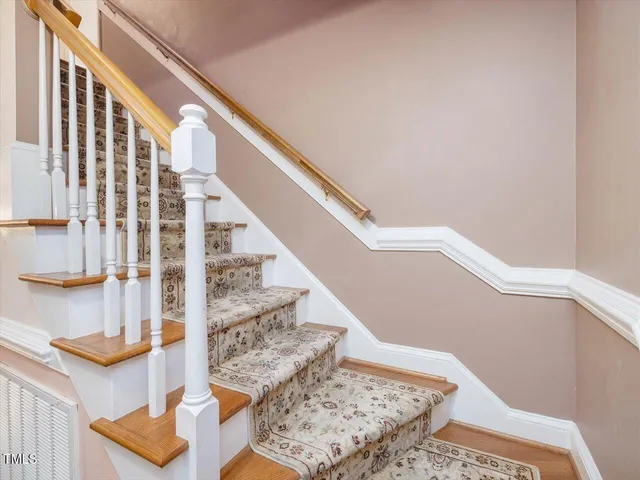 a view of a livingroom with a ceiling fan and window