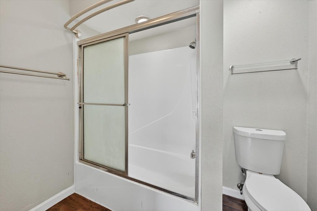 9809 Matchpoint Place Dallas, TX 75243 - Photo 20 of 21 Up stairs Shower-tub combination with sliding glass enclosure and integrated shower head
