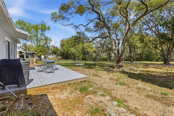 a view of a yard with an outdoor space