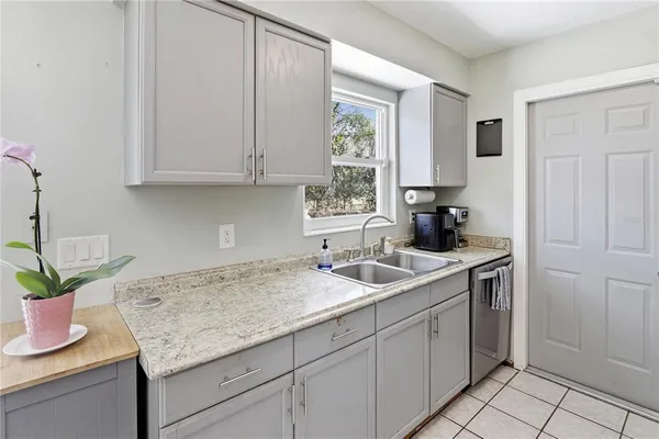 a kitchen with a sink and cabinets