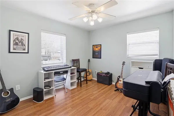 a bedroom with furniture and a window