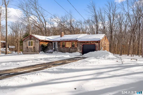 a kitchen with a sink cabinets and window