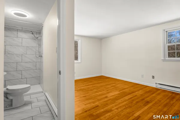 a bathroom with a toilet and a sink