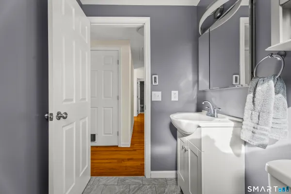 a bathroom with a sink and a shower curtain