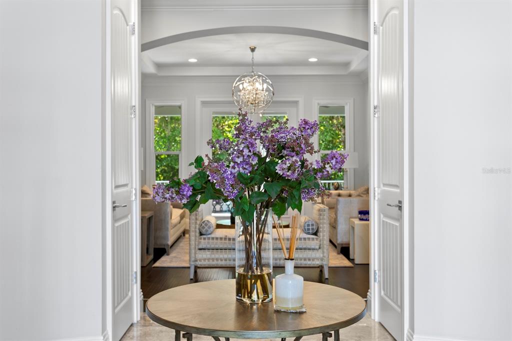 2604 South Bryant Circle Tampa, FL 33629 - Photo 13 of 49 a vase of flowers sitting on a table with a fireplace