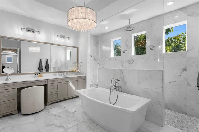a white bath tub sitting next to a window