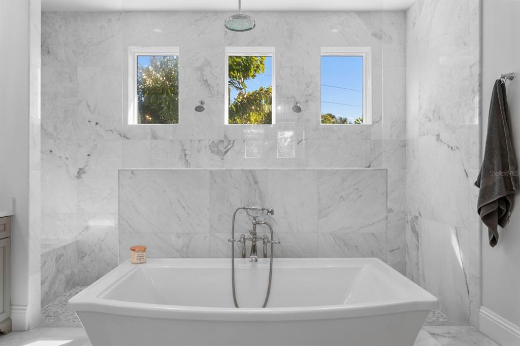 2604 South Bryant Circle Tampa, FL 33629 - Photo 28 of 49 a white bath tub sitting next to a window