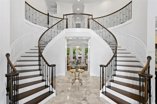 a view of entryway with wooden floor and a front door