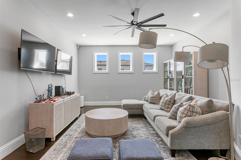 2604 South Bryant Circle Tampa, FL 33629 - Photo 32 of 49 a living room with furniture and a flat screen tv