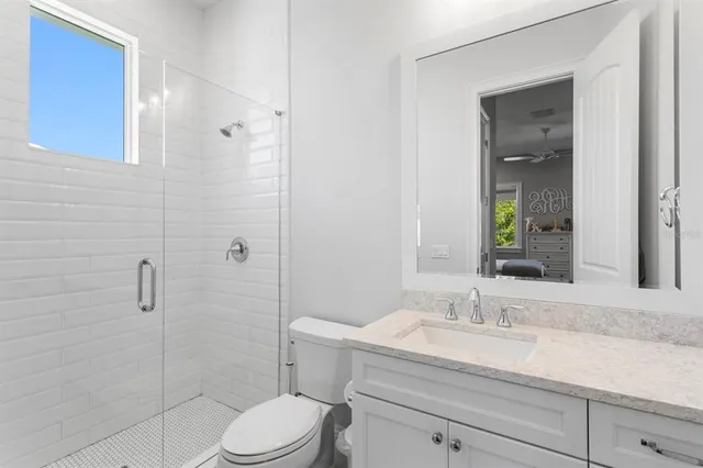 a bedroom with a bed and a table