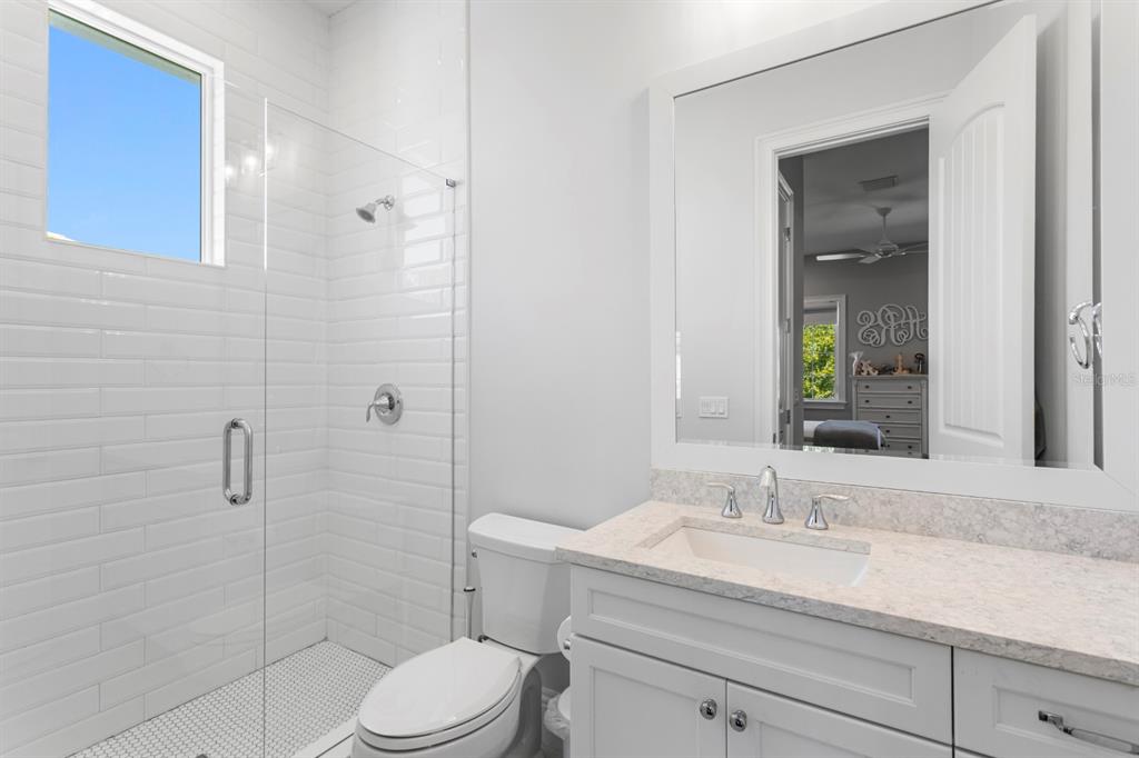 2604 South Bryant Circle Tampa, FL 33629 - Photo 34 of 49 a bathroom with a sink a toilet and shower