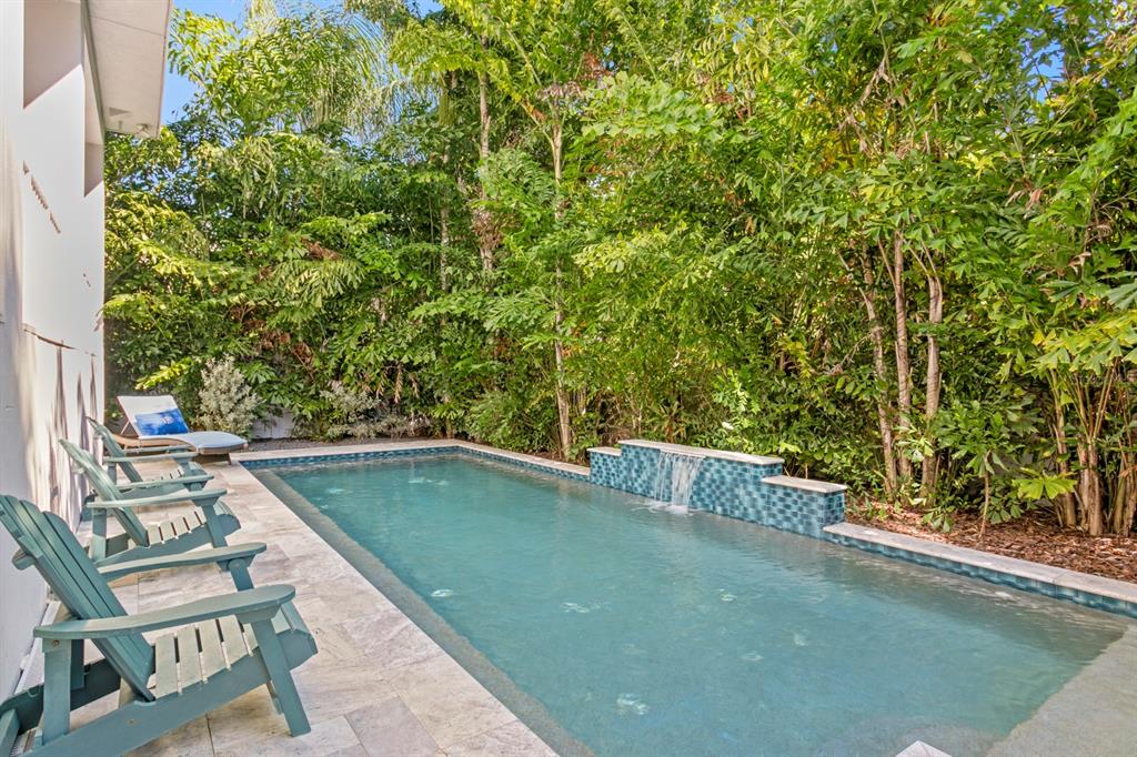 2604 South Bryant Circle Tampa, FL 33629 - Photo 45 of 49 a view of a swimming pool with a yard