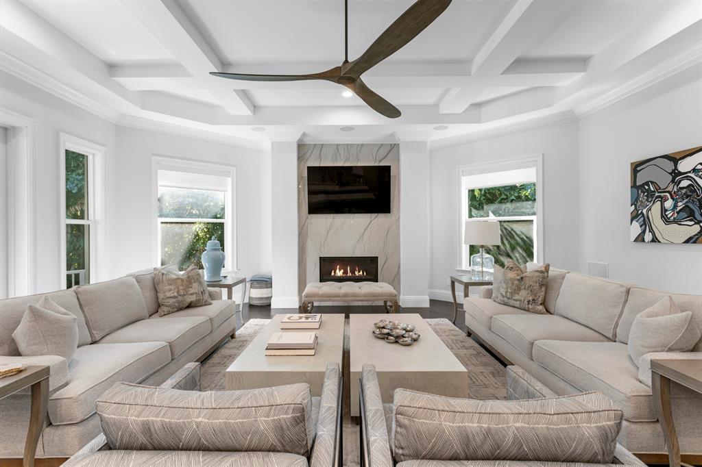 2604 South Bryant Circle Tampa, FL 33629 - Photo 5 of 49 a living room with furniture a fireplace and a flat screen tv