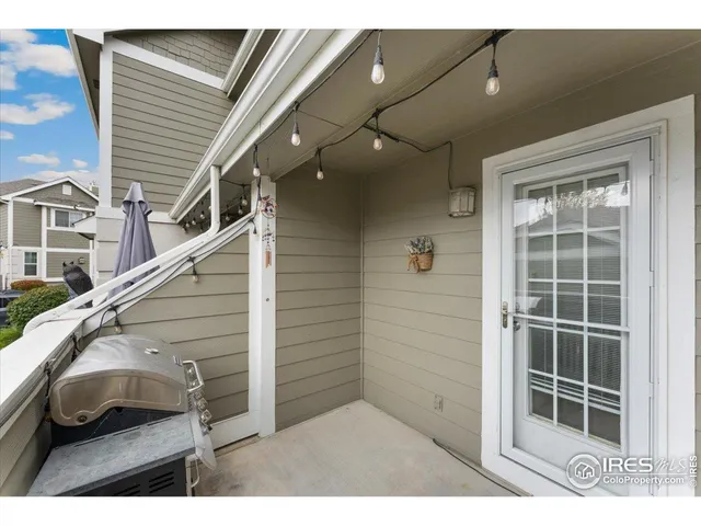 an aerial view of residential houses with outdoor space and street view