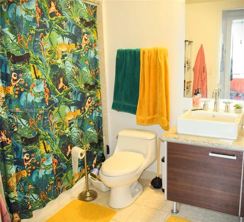 a bathroom with a toilet and a sink