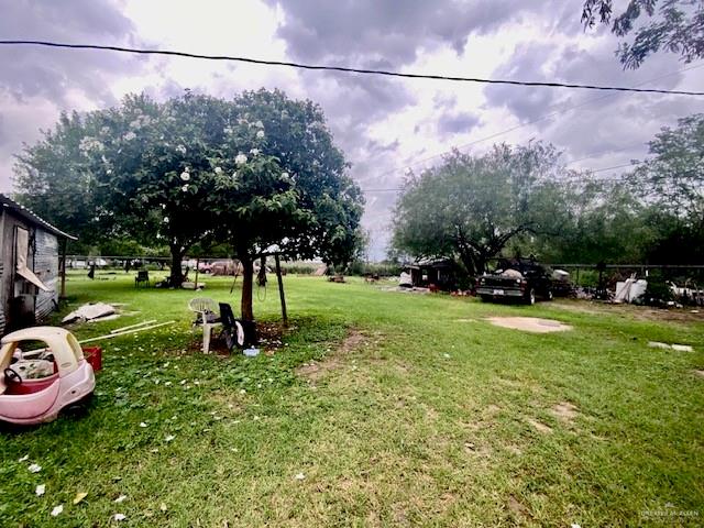 5910 Alpine Avenue Mission, TX 78574 - Photo 4 of 15 a view of a garden with a car parked in the background