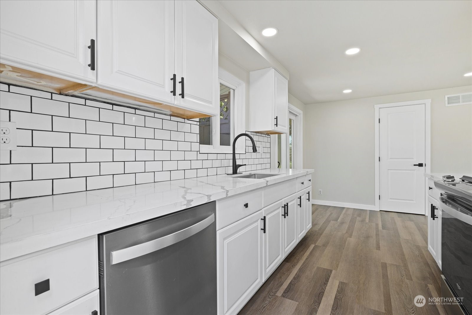 16820 120th Avenue Southeast Renton, WA 98058 - Photo 13 of 31 a kitchen with a sink and cabinets