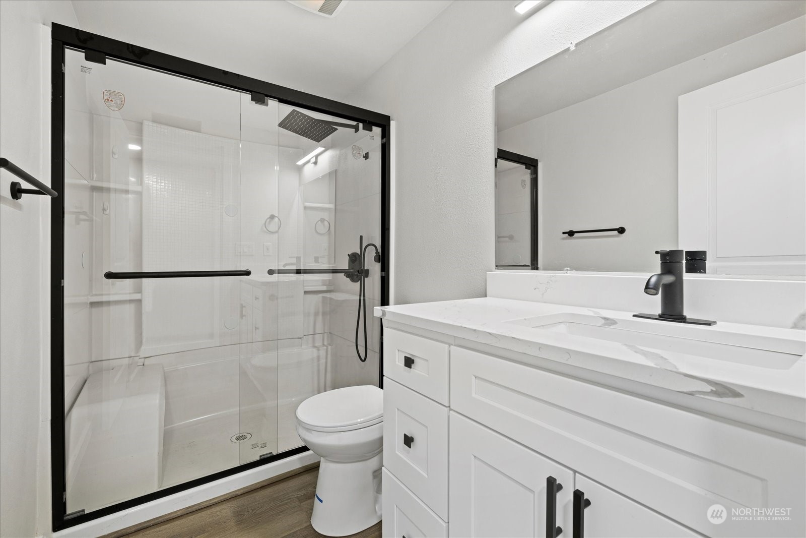 16820 120th Avenue Southeast Renton, WA 98058 - Photo 18 of 31 a bathroom with a sink a toilet and shower