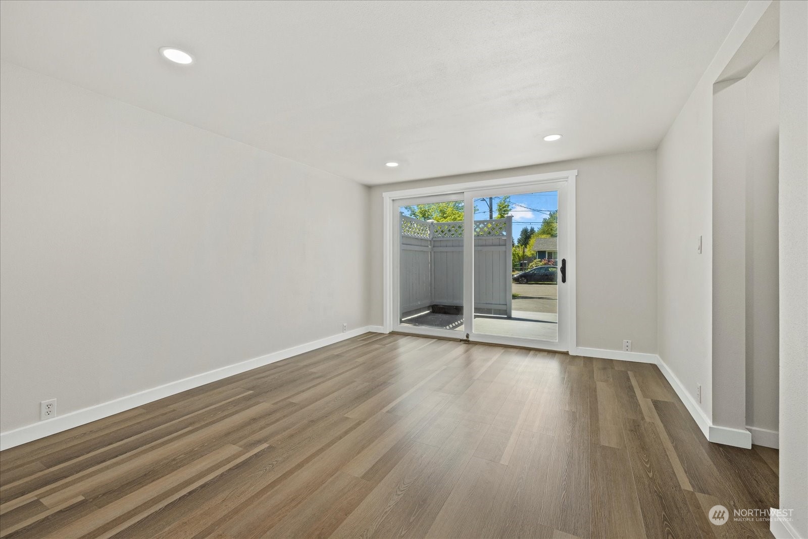 16820 120th Avenue Southeast Renton, WA 98058 - Photo 20 of 31 a view of an empty room with wooden floor and a window
