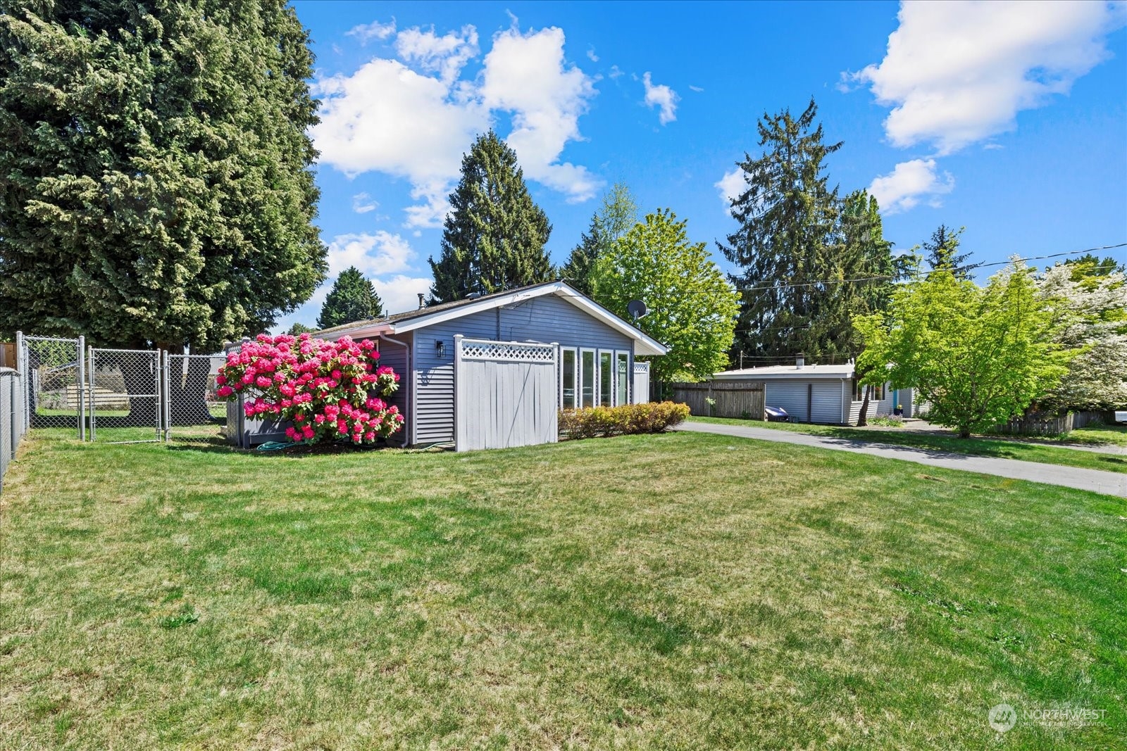 16820 120th Avenue Southeast Renton, WA 98058 - Photo 2 of 31 a front view of a house with garden