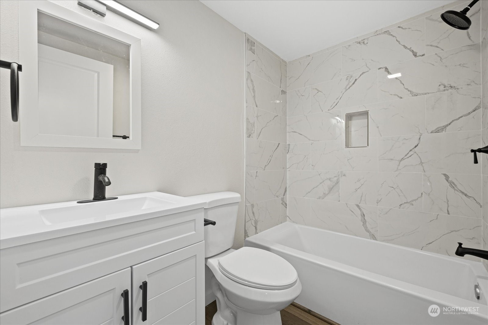 16820 120th Avenue Southeast Renton, WA 98058 - Photo 23 of 31 a bathroom with a sink a toilet and a bathtub