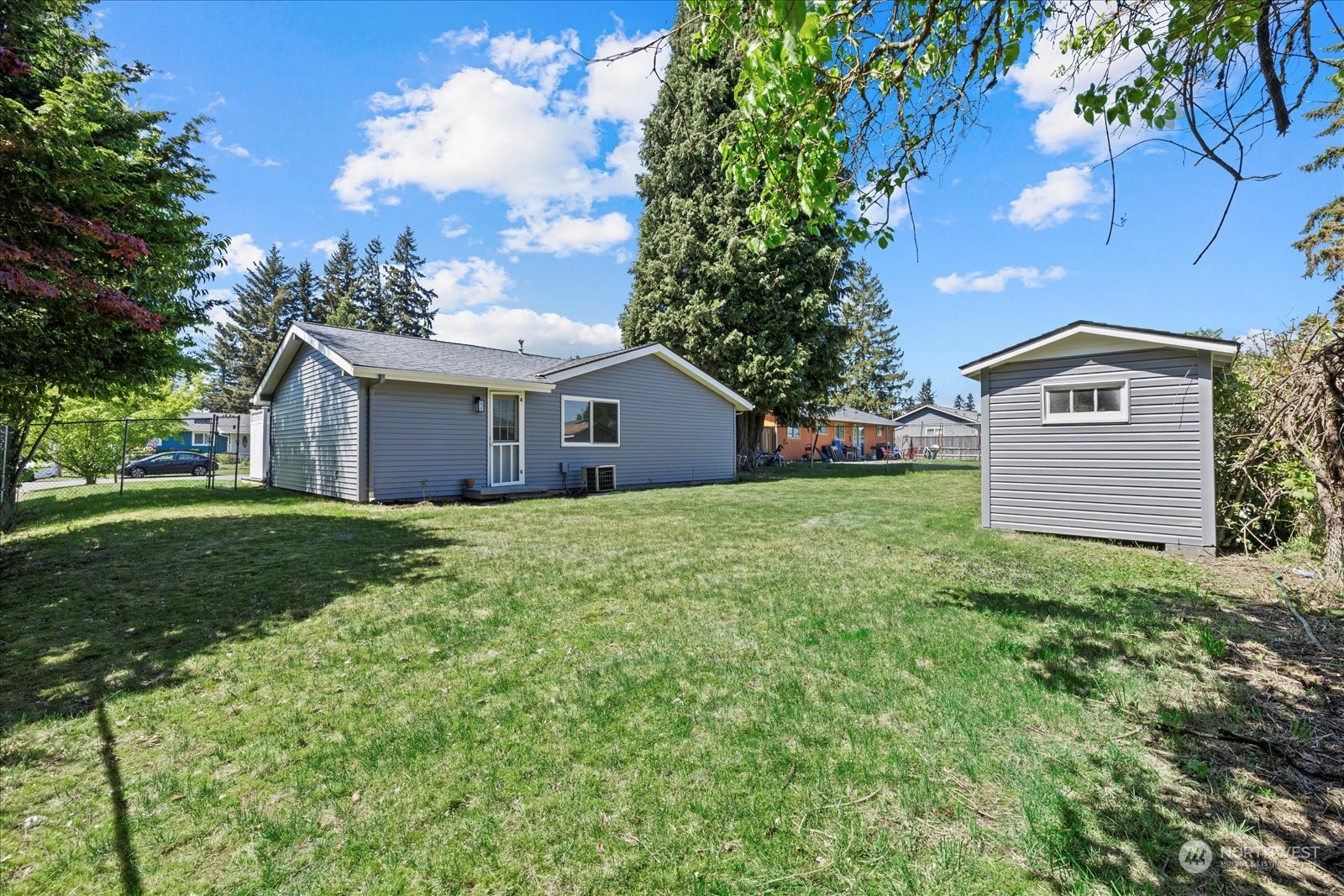 16820 120th Avenue Southeast Renton, WA 98058 - Photo 30 of 31 a view of a house with a yard