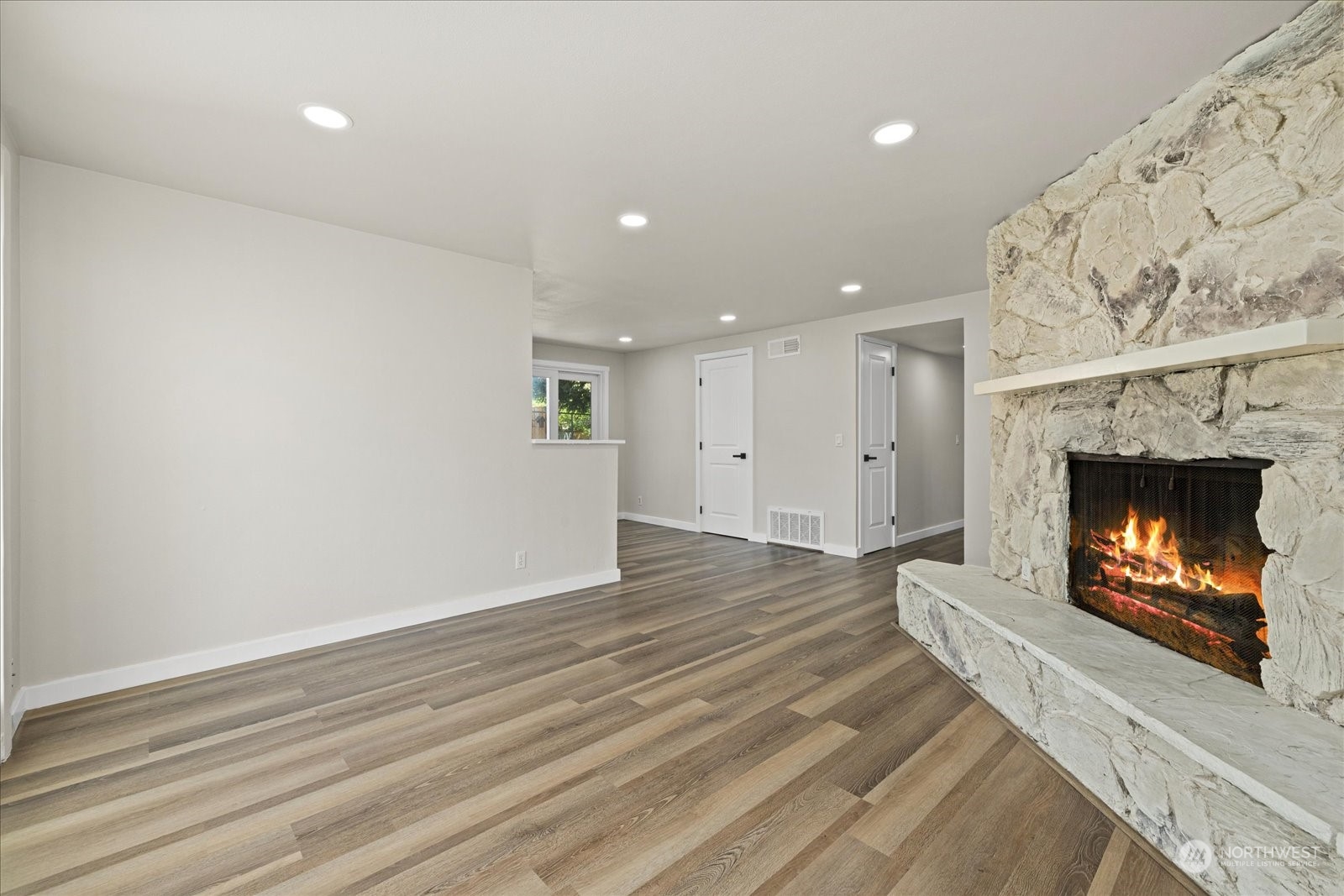 16820 120th Avenue Southeast Renton, WA 98058 - Photo 6 of 31 a view of an empty room and fire place
