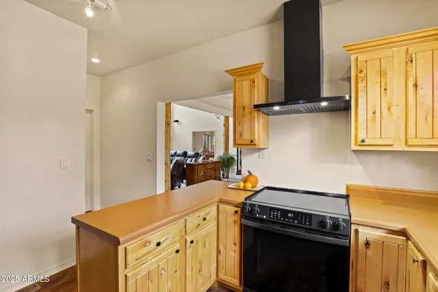 a kitchen with stainless steel appliances a stove and a refrigerator