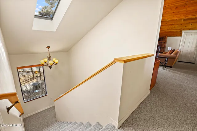 a hallway with paintings on the wall