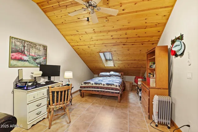 a bedroom with furniture and a window