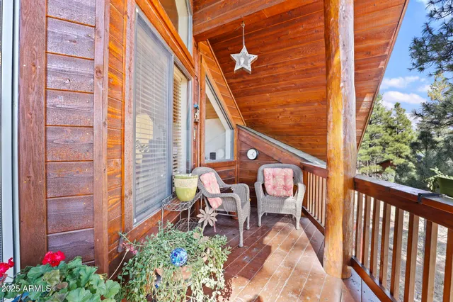 a balcony view with a seating space